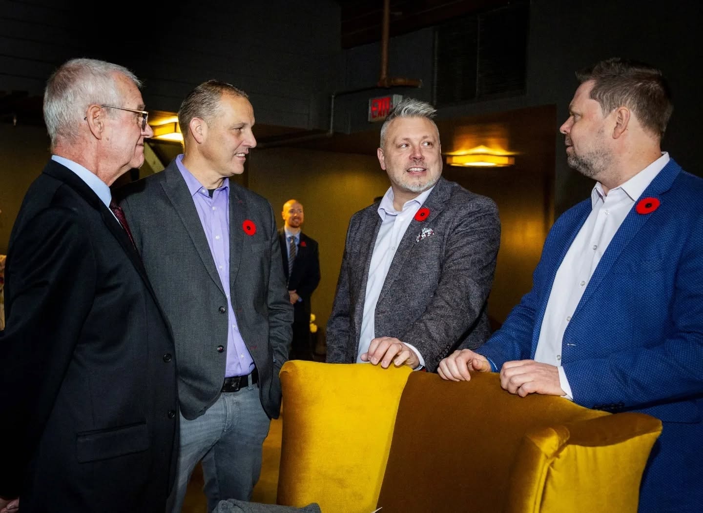 Ken Engler talking with conservative colleagues at a campaign reception